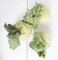 Three pieces of kohlrabi vegetable isolated on yellow simple background with copy space Royalty Free Stock Photo