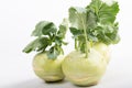 Three pieces of kohlrabi vegetable isolated on yellow simple background with copy space Royalty Free Stock Photo