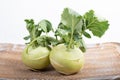 Three pieces of kohlrabi vegetable isolated on yellow simple background with copy space Royalty Free Stock Photo