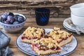 Three pieces of plum cake with crumble