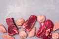 Three Pieces of Raw Fresh Beef Meat Steak Raw Chicken and Raw Chicken Cutlets on Gray Background Horizontal Top View Copy Space Royalty Free Stock Photo