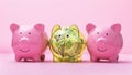 Three piggy banks on a pink background, the concept of investing in the dollar
