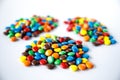 Three piles of colored smarties Royalty Free Stock Photo