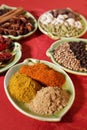 Three piles of indian powder spice on plate