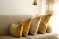 Three pillows on sofa near wall. Interior design