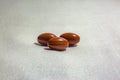 Three pills on a white background with fabric texture shot in st Royalty Free Stock Photo