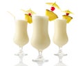 Three Pina colada coconut cocktails isolated on white Royalty Free Stock Photo
