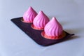 Three pink cakes on a white tablecloth. Royalty Free Stock Photo