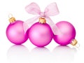 Three pink christmas balls with ribbon bow Isolated on white Royalty Free Stock Photo