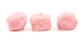 Three pink cream puffs in a row