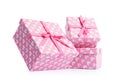 Three pink gift boxes, on white background. File contains a path to isolation.