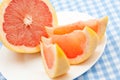 Three pink grapefruit segments