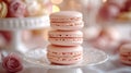 Three pink macarons stacked on a small white cake stand Royalty Free Stock Photo