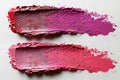 Three pink and red makeup smudges isolated on a white background Royalty Free Stock Photo