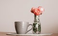 Three pink roses and big cup of tee Royalty Free Stock Photo