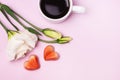 Three Pink Roses Tasty Homemade Candy in Shape of Hearts and Cup Of Coffee on Pink Background Valentine Day Concept or Card Royalty Free Stock Photo