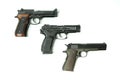 Three pistols on a white background