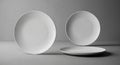 Three White Ceramic Plates Arranged on a Textured Surface with Soft Lighting dish tableware Royalty Free Stock Photo