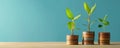 Three plants growing on stacks of coins. Royalty Free Stock Photo
