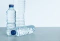 Three plastic bottles filled with mineral water on white background Royalty Free Stock Photo