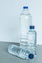 Three plastic bottles filled with mineral water on white background Royalty Free Stock Photo