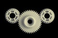 3 plastic gears on black background