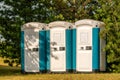 Three plastic portable toilets Royalty Free Stock Photo