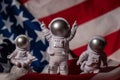 Three Plastic toys figure astronaut on American flag background Copy space. 50th Anniversary of USA Landing on The Moon Royalty Free Stock Photo