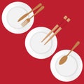 Three plates on red background one with a spoon, one with fork and knife and one with chopsticks Royalty Free Stock Photo