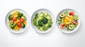 Three plates with salad on each plate isolated on white created with Generative AI