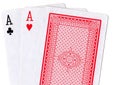 Three playing cards with a pair of aces revealed.