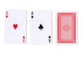 Three playing cards with a pair of aces revealed.