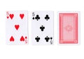 Three playing cards with a pair of fives revealed.