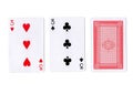 Three playing cards with a pair of threes revealed.