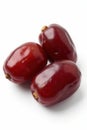 Three plump, dark brown dried dates, isolated , arabic, still life Royalty Free Stock Photo