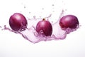 Three plums are splashing into the water. Digital image.