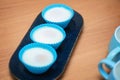 Three poached eggs in blue silicone molds on an elongated plate, ready for breakfast Royalty Free Stock Photo