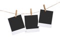 Three polaroid photos hanging on craft rope with clothespins isolated on white background Royalty Free Stock Photo