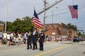 Three police officers walking in front of the fourth of July parade Royalty Free Stock Photo