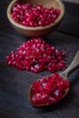 pomegranate with bowl on real wooden table