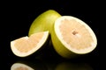 Three pomelos,half,quarter isolated on black