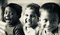 Three poor kids smiling together