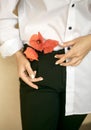 Three poppy flowers and ladyâs hands