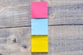 Three post its on wooden background