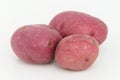 Three potatoes on white background