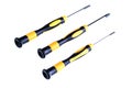 Three precision screwdrivers with yellow and black handles on a white background Royalty Free Stock Photo