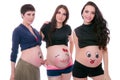 Three pregnant women isolated on white