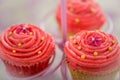 Three pretty pink Bollywood cupcakes