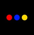 Three primary colours dots on black background