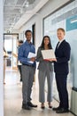 Professional diverse team young business people standing in office. Vertical Royalty Free Stock Photo